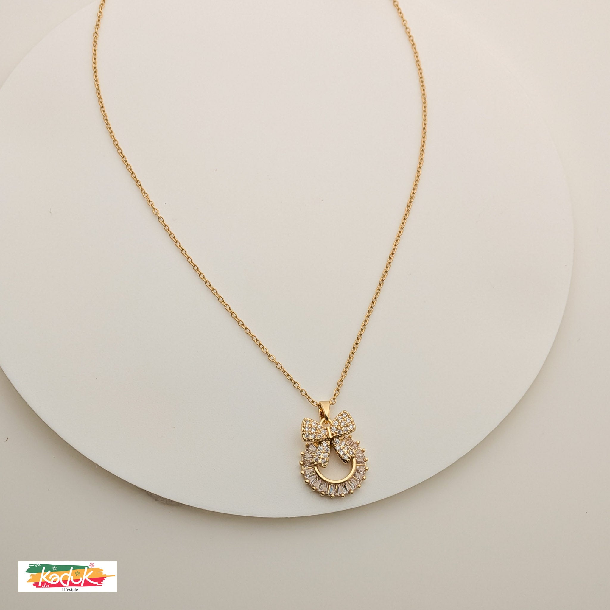 Gold Bow Pendant Necklace with Crystals – Elegant Party Wear Jewelry