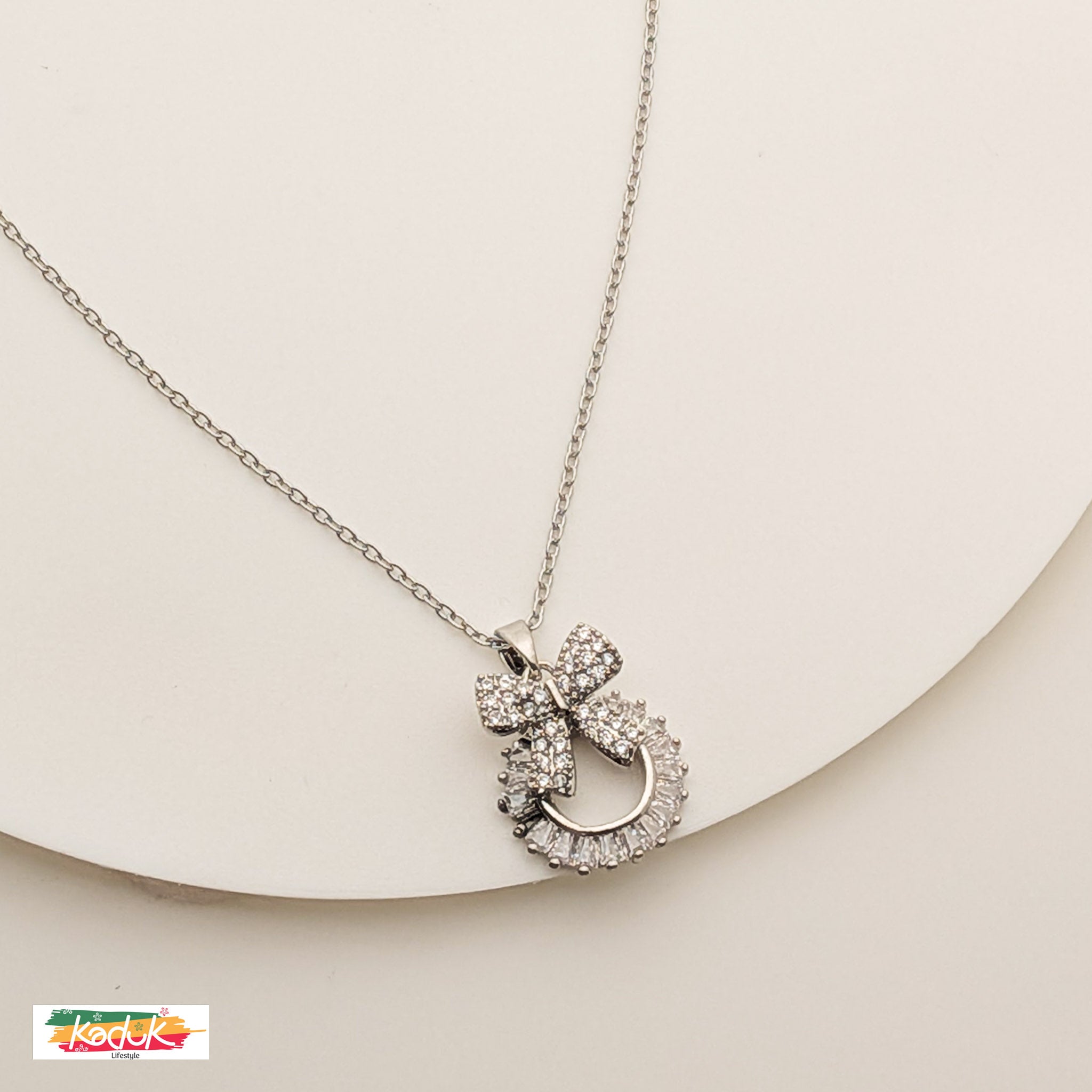 Silver Bow Pendant Necklace with Crystals – Elegant Jewelry for Women
