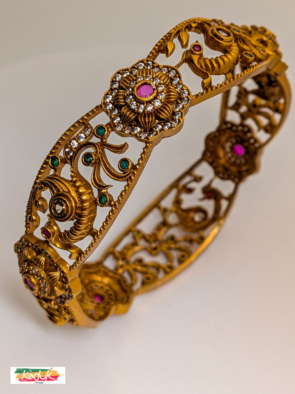 Antique Gold-Plated Floral & Peacock Bangle with Ruby & Emerald Stones – Traditional Bridal Jewellery