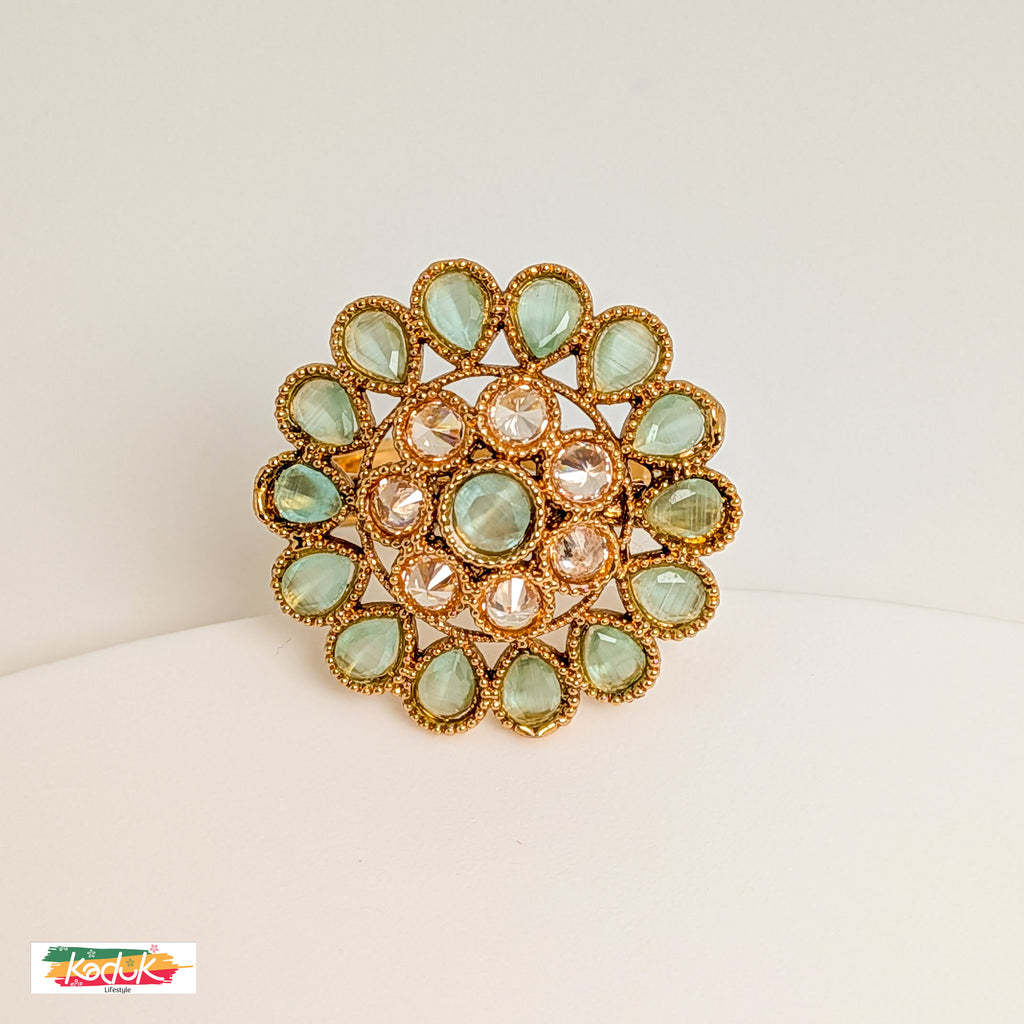 Elegant Floral Statement Ring with Green Gemstones