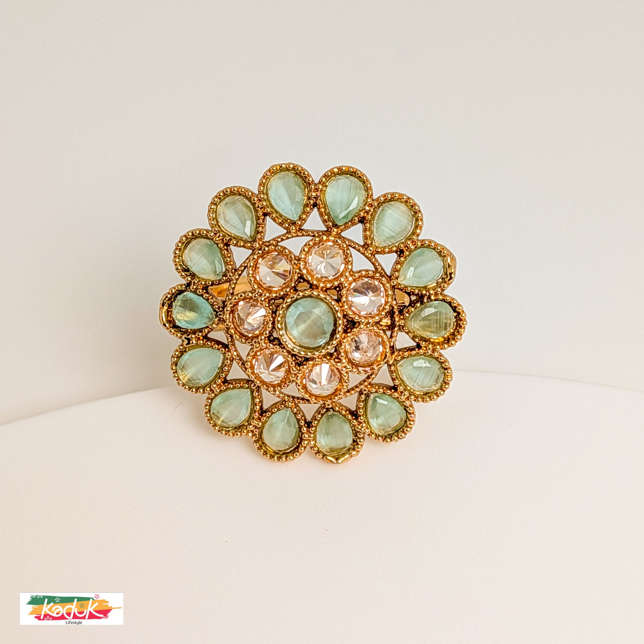 Elegant Floral Statement Ring with Green Gemstones