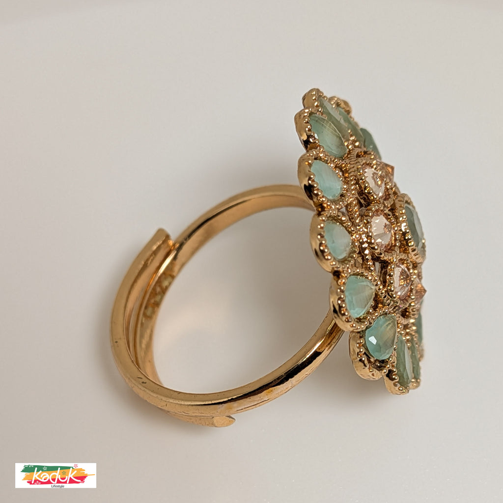 Elegant Floral Statement Ring with Green Gemstones