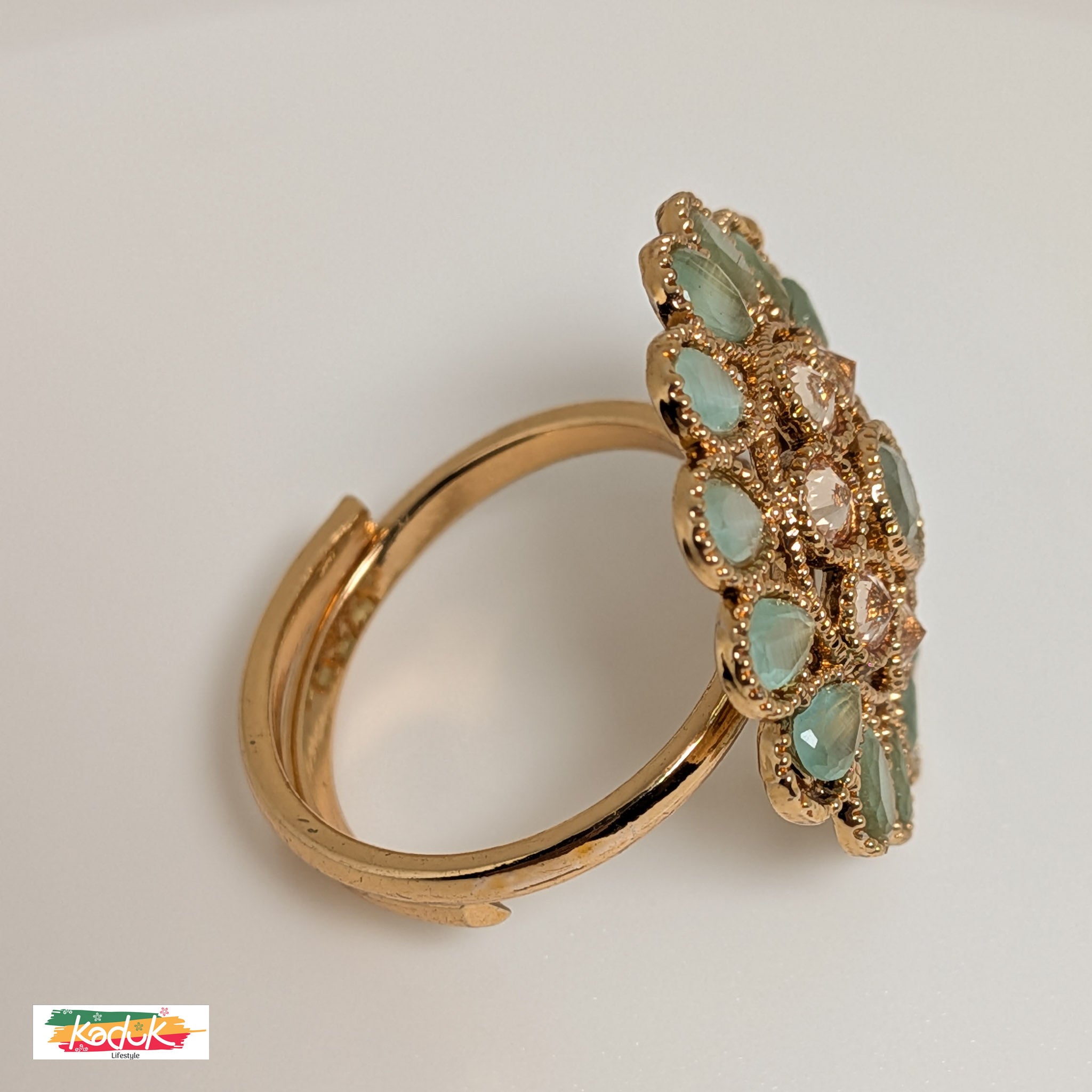 Elegant Floral Statement Ring with Green Gemstones