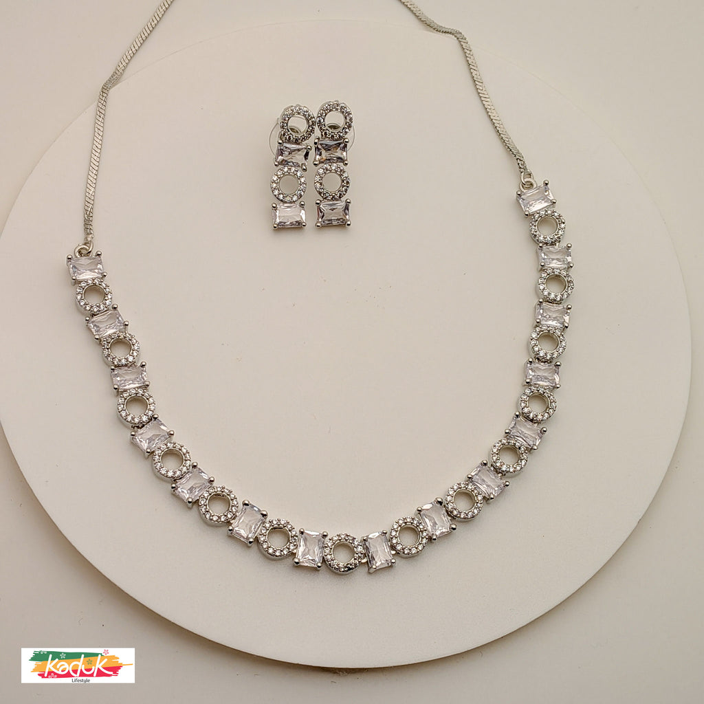 Elegant Silver AD  Necklace with Rectangular & Round Crystal Motifs – Matching Earrings