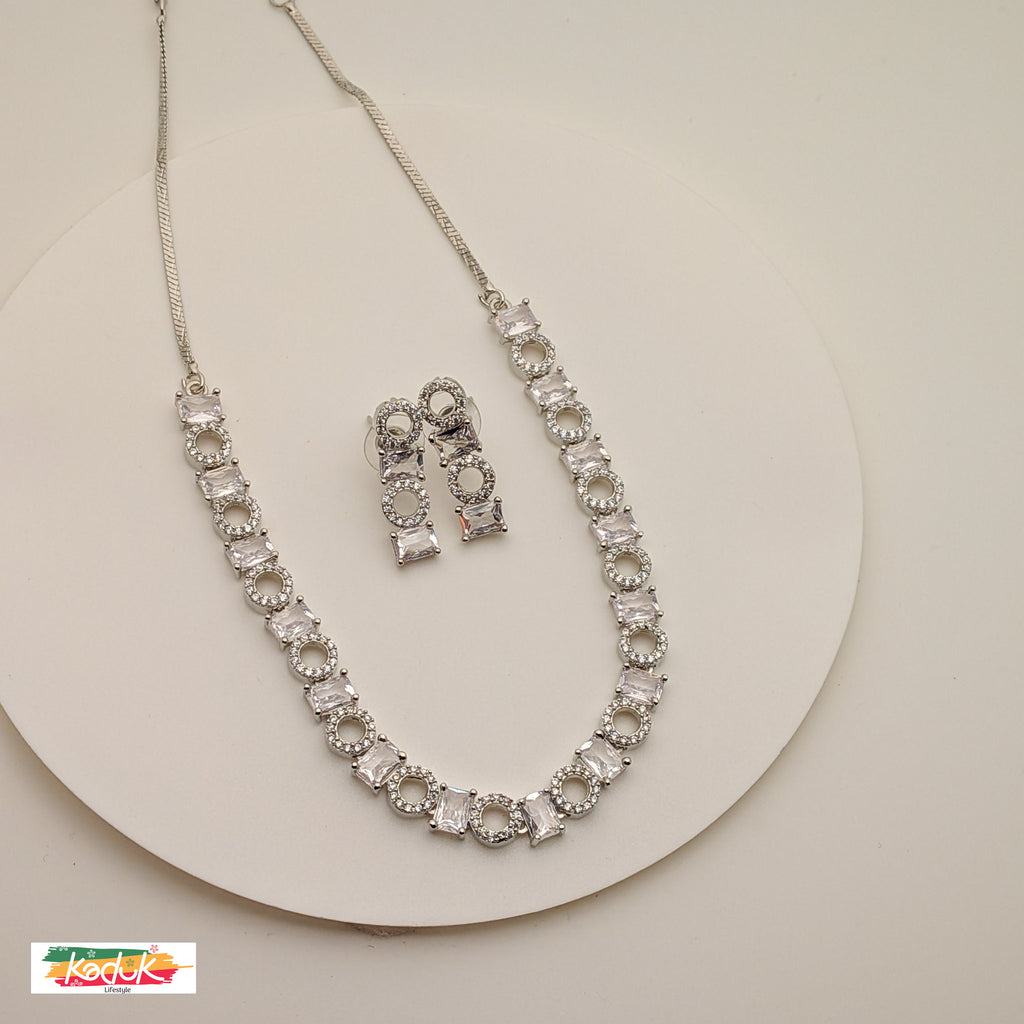 Elegant Silver AD  Necklace with Rectangular & Round Crystal Motifs – Matching Earrings