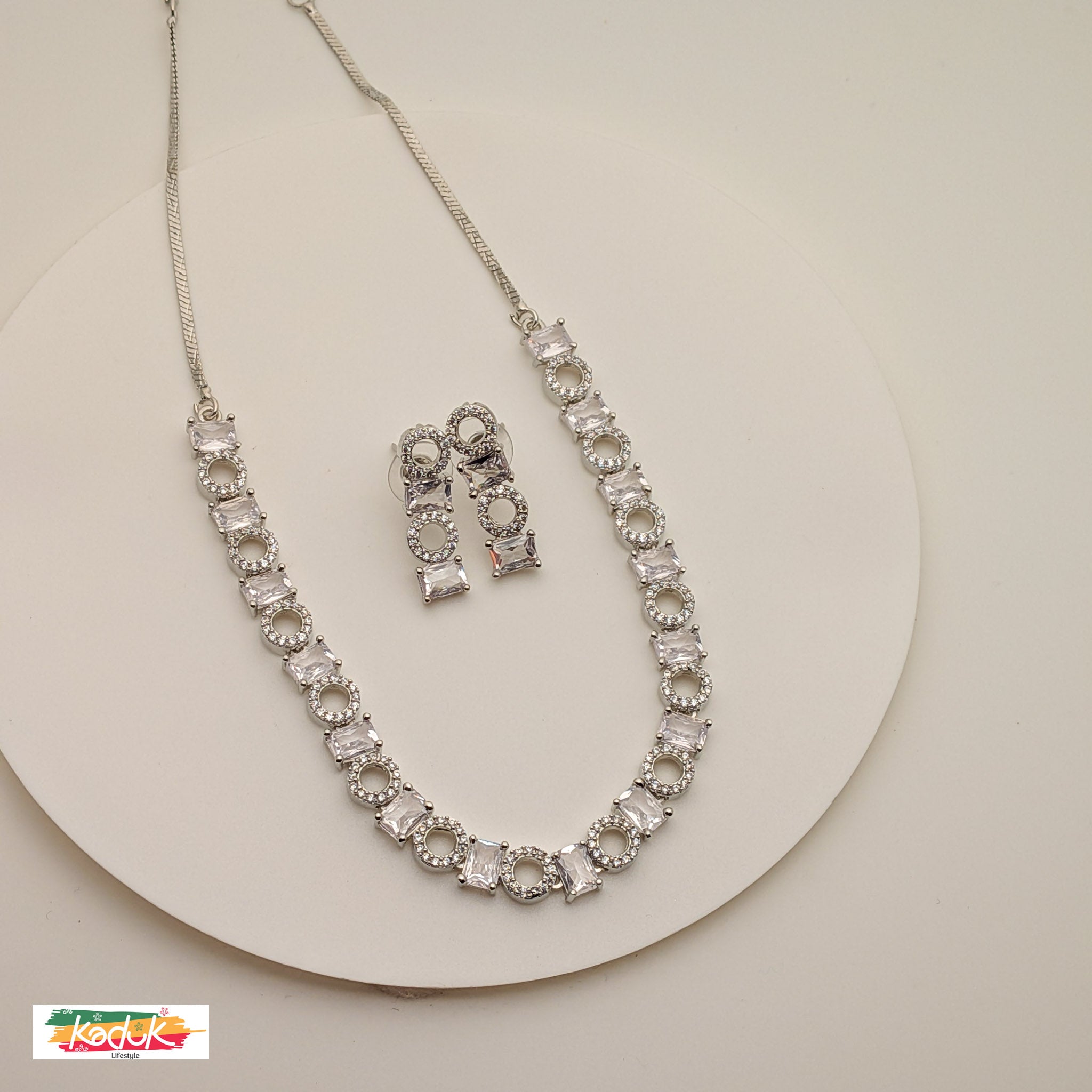 Elegant Silver AD  Necklace with Rectangular & Round Crystal Motifs – Matching Earrings
