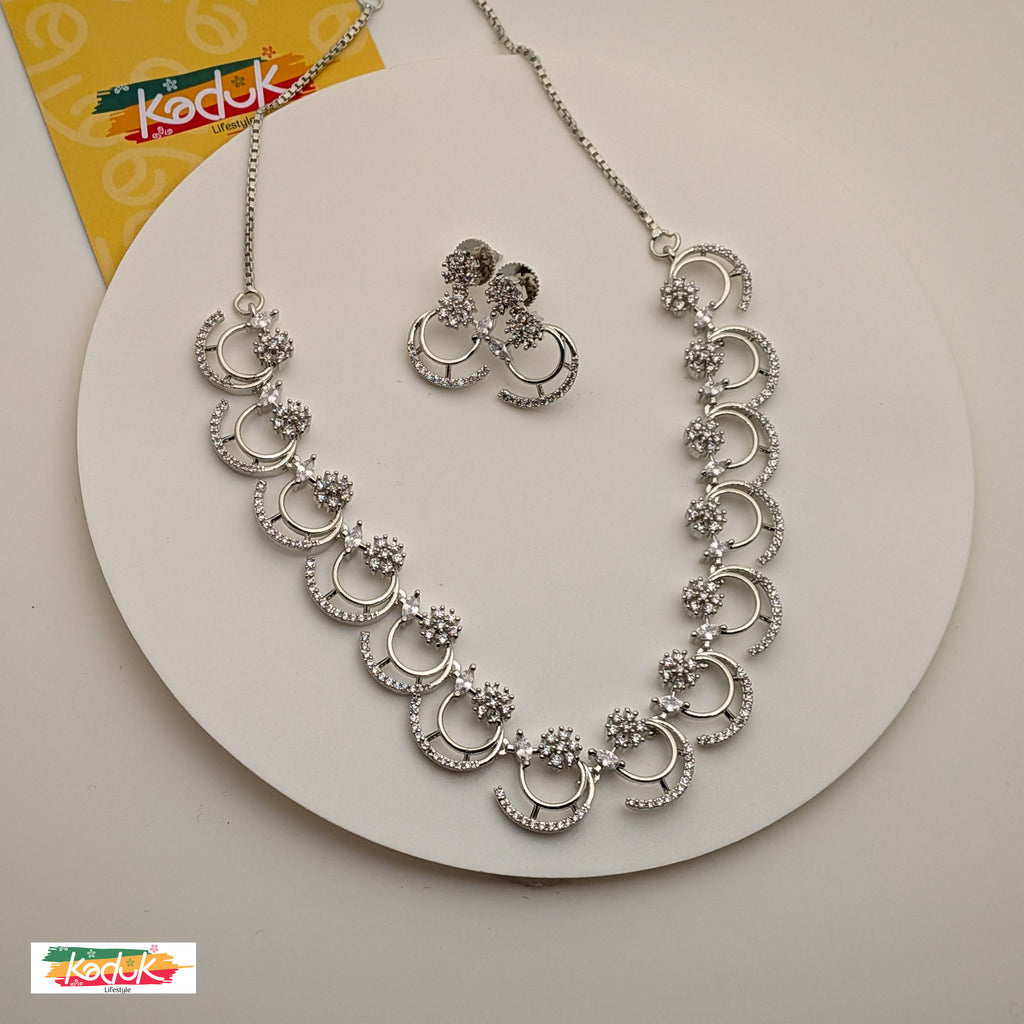 🌙 Silver AD Crescent Crystal Necklace with Floral Accents & Earrings